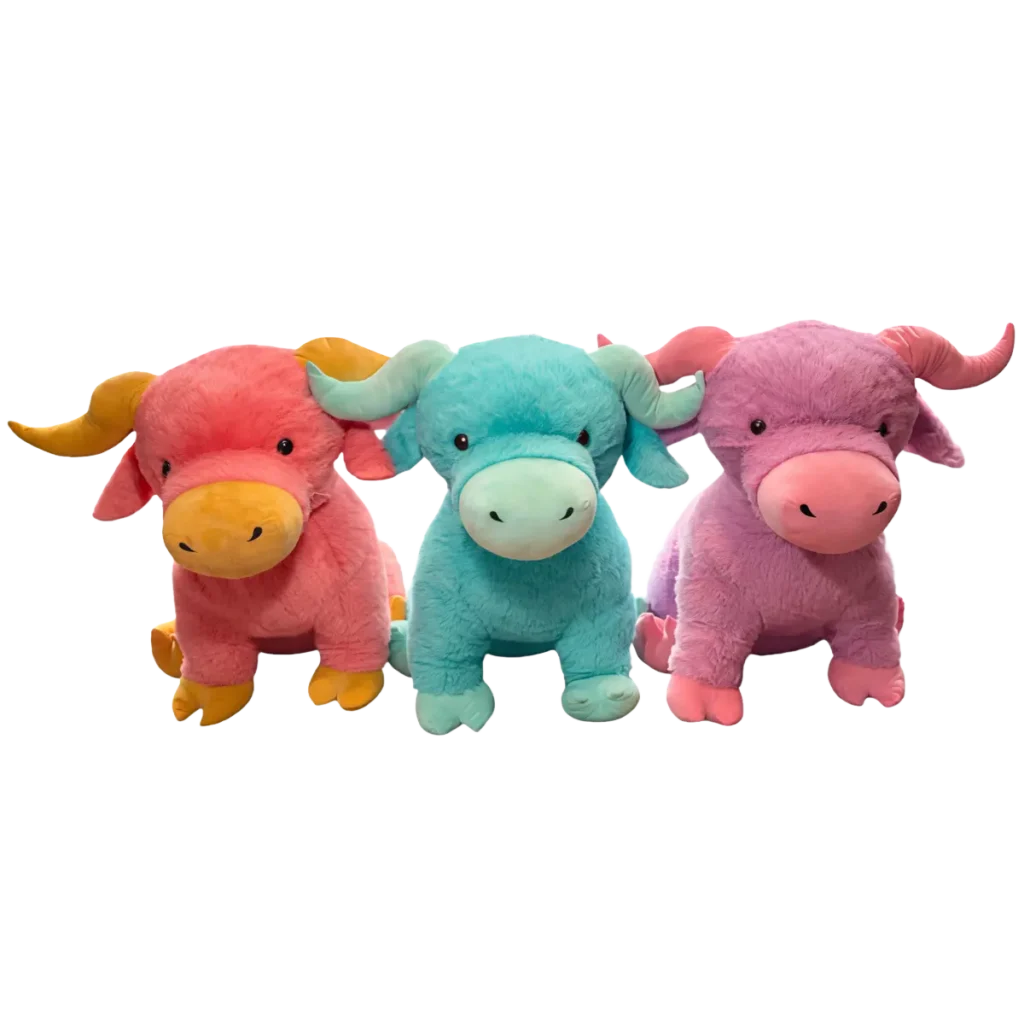 Three plush bull toys in red, blue, and purple colors, sitting side by side on a clean white background.