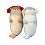 Two plush otter toys in brown and blue colors with earmuffs, standing upright side by side on a white background.
