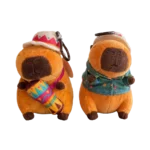 Two plush capybara keychain toys wearing hats, one holding a colourful maraca and the other wearing a green shirt.