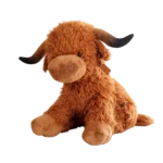 Brown Highland cow plush toy with shaggy fur and curved horns, shown at an angle on a white background.