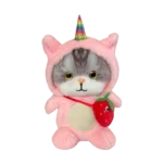 Pink plush cat kitten in unicorn costume with rainbow horn and strawberry shoulder bag, shown at a three-quarter angle on a white background.