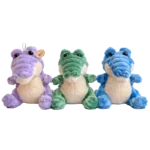 Three plush crocodile in purple, green and blue with cream belly sitting upright transparent background