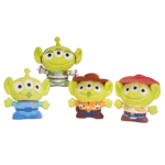 Set of four green Toy Story alien plush toys (25cm) in different outfits including Buzz Lightyear and cowboy styles, isolated on a white background.