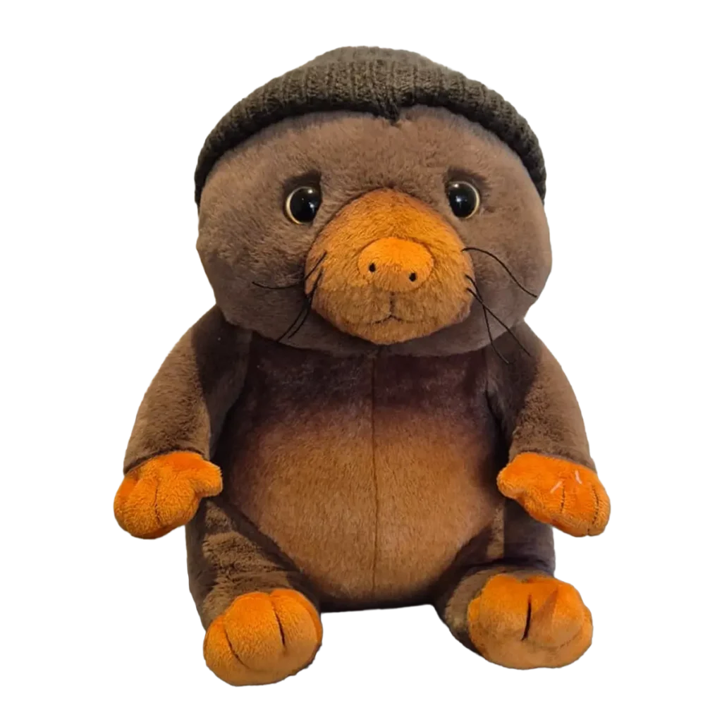 Soft plush platypus wearing a grey knitted beanie, with brown body, orange beak and feet, sitting upright on a clean gradient background.
