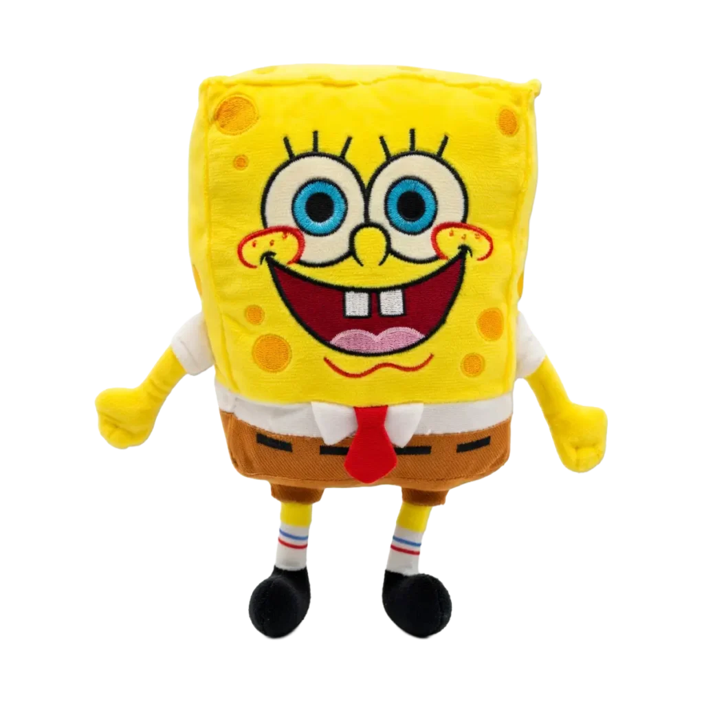 Yellow SpongeBob plush toy with big blue eyes, red tie, and brown shorts, standing upright with a cheerful expression