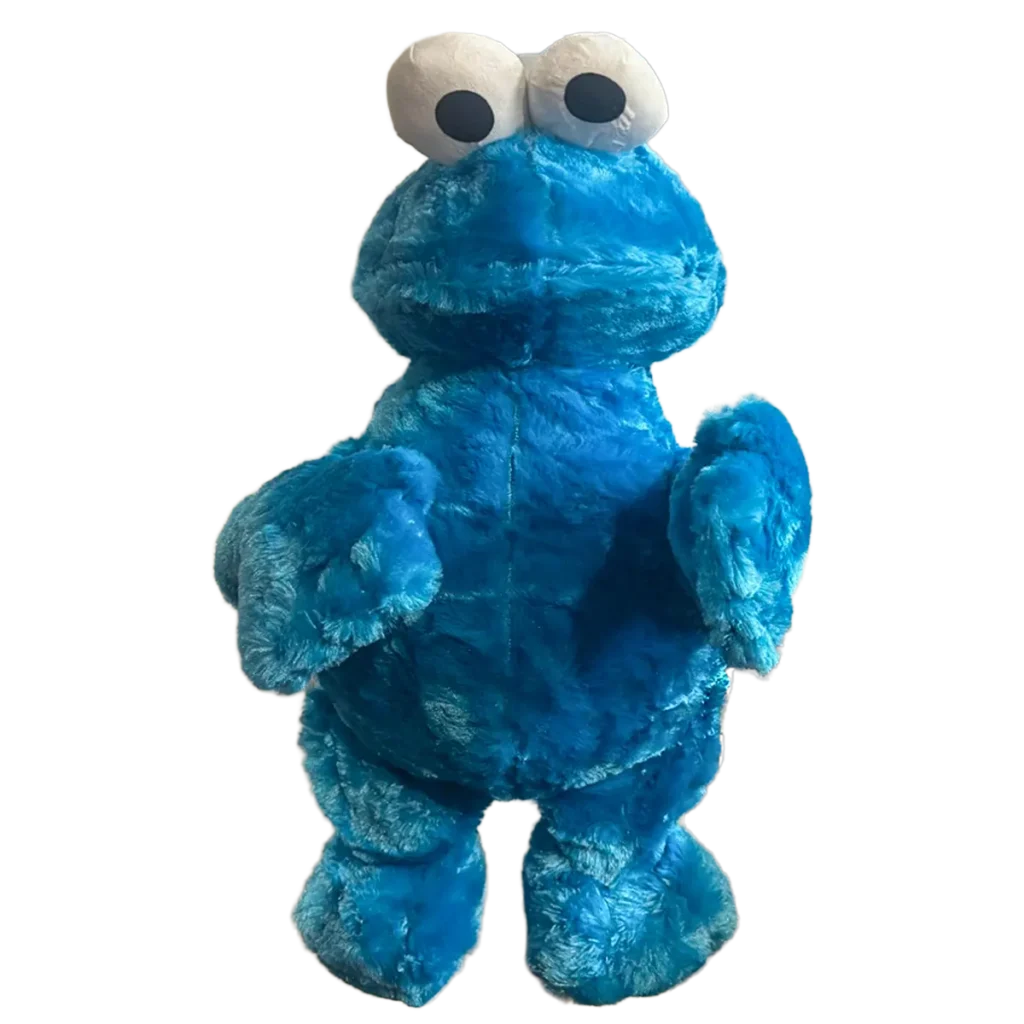 Large blue monster plush with bright blue fur, oversized white eyes, and a playful expression. The character stands upright with outstretched arms against a white background.
